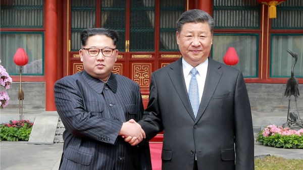 图为2019年1月7日中国国家主席习近平会见到访中国的朝鲜领导人金正恩时合影。 （图片来源：AFP/Getty Images)