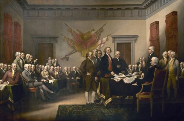 图为描绘1776年美国建国者们签署《独立宣言》情景的油画。
