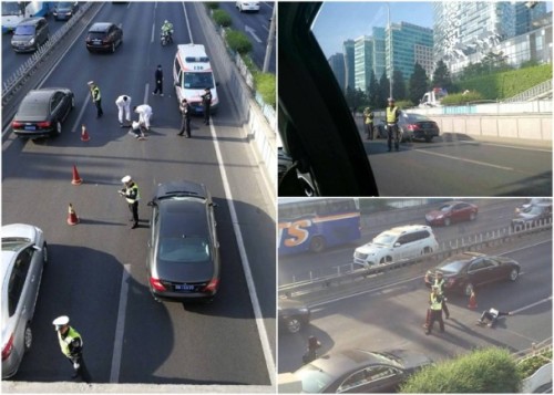 北京女跳橋砸車嚇壞駕駛交通大堵塞