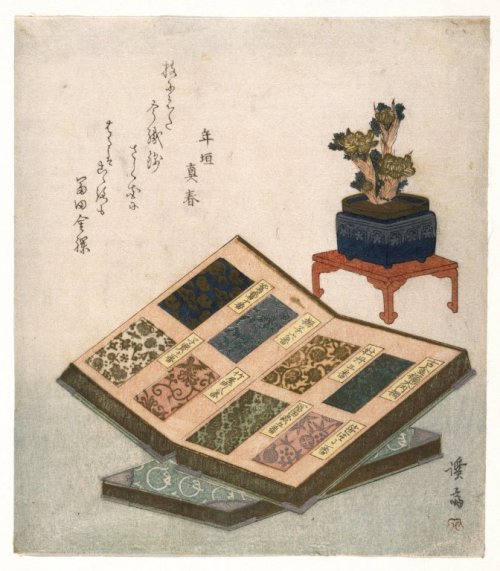 日本江户时代描绘丝绸样品簿的画作。