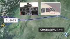 玻璃破碎中國客機飛行中副駕半身掛窗外(圖)